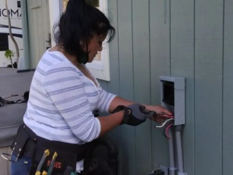 Licensed electrician wiring an exterior subpanel in Lathrup Village