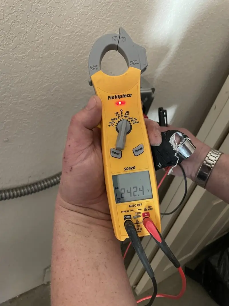 Voltage testing with clamp meter during Ceiling Fan Installation in Lathrup Village